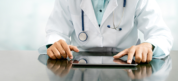 Neurologist Using Tablet